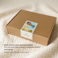A brown cardboard gift box with a colorful MIKOU label sits on a cream-colored textured blanket. Text on the left reads, 'What arrives when parents redeem"