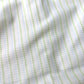 Close-up of fabric with green and blue striped pattern