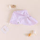 Flat Lay of a Parma Lavender sun hat in UPF50+ fabric with longer brim at the back to protect the neck from sunburn | MIKOU