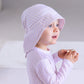 Baby wearing a Parma Lavender sun hat in UPF50+ fabric with longer brim at the back to protect the neck from sunburn | MIKOU