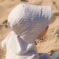 Baby sun hat  made with UPF50+ fabric, with wider brim at the back | MIKOU