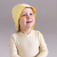 Front of a Sunny Yellow sun hat in UPF50+ fabric with longer brim at the back to protect the neck from sunburn | MIKOU